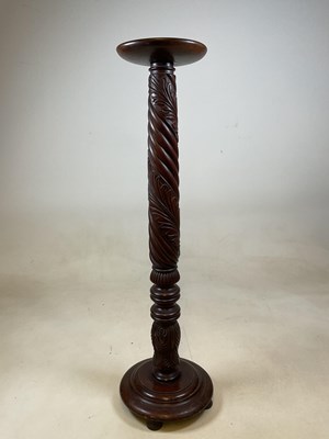 Lot 628 - An early 20th century wrythen twisted torchère...