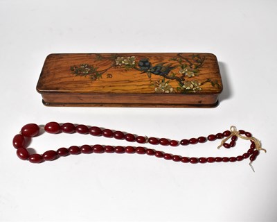 Lot 1231 - A cherry red amber-style graduated bead...