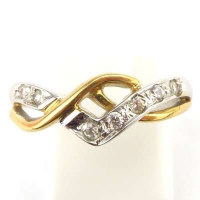 Lot 916 - An 18ct two-tone gold ring, a white gold...