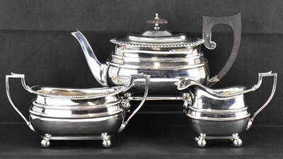 Lot 723 - A George V hallmarked silver three-piece tea...