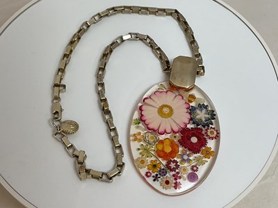 Lot 410 - MATTHEW WILLIAMSON; a lucite floral decorated...