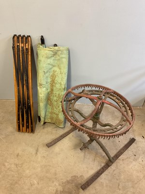 Lot 515 - A vintage canvas and wooden framed folding bed,...