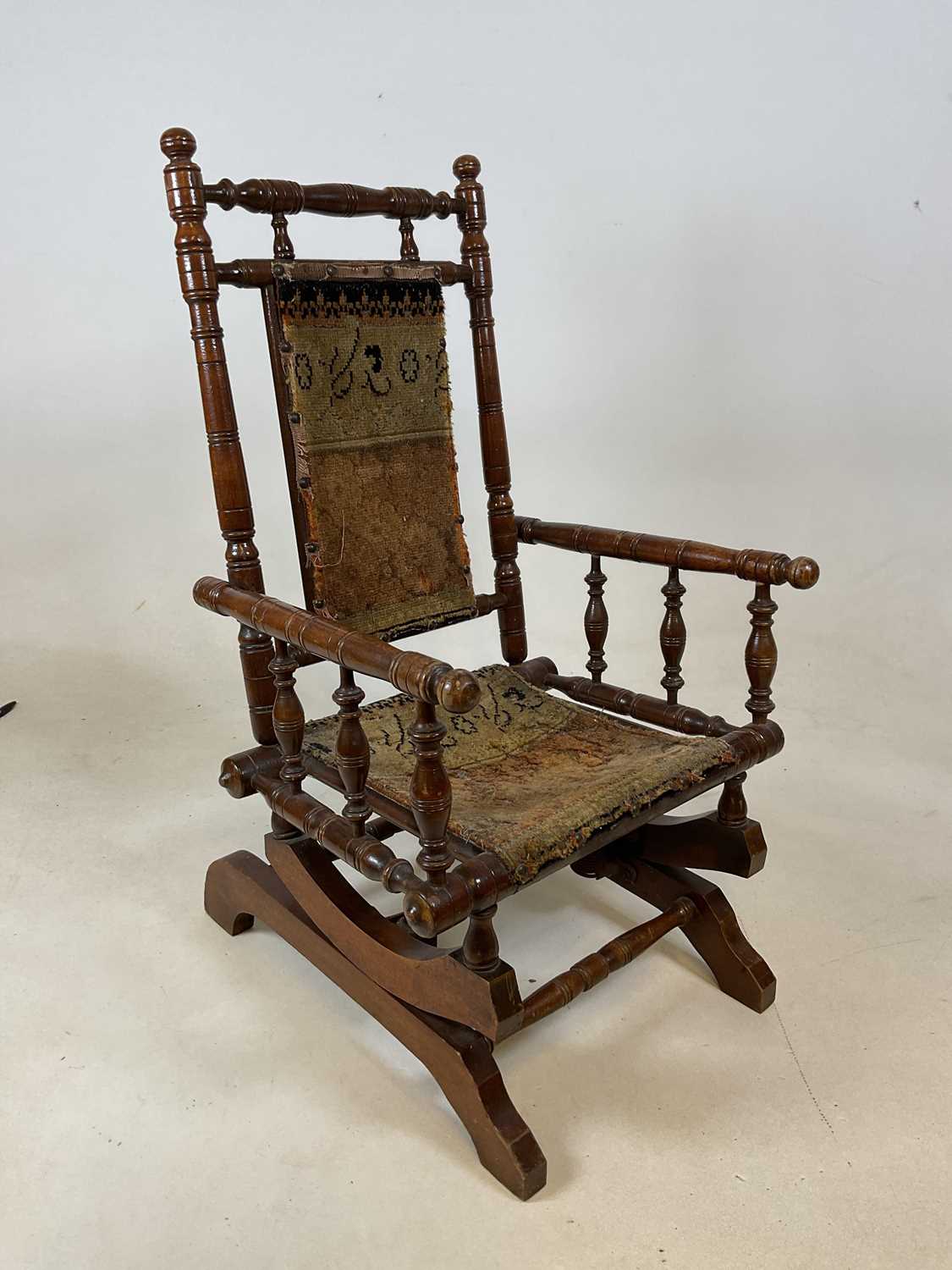 Lot 627 - An early 20th century child's American rocking...
