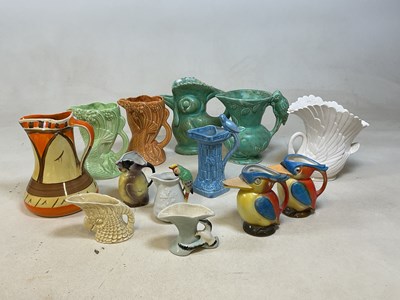 Lot 185 - Thirteen Art Deco jugs, mostly bird related,...