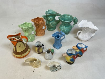 Lot 185 - Thirteen Art Deco jugs, mostly bird related,...