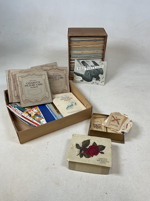 Lot 276 - A large collection of cigarette cards within...