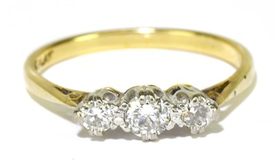 Lot 60 - An 18ct yellow gold platinum tipped three...