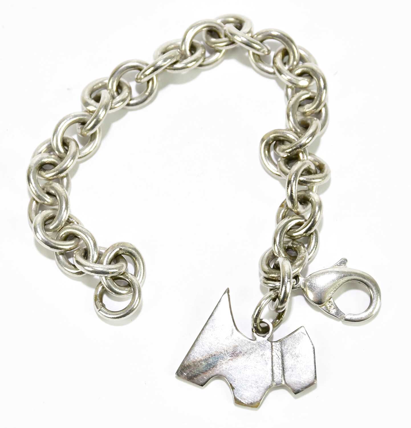 Lot 588 - TIFFANY & CO; a silver dog charm with Tiffany...