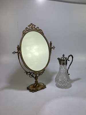 Lot 2150 - A decorative brass dressing table mirror,...