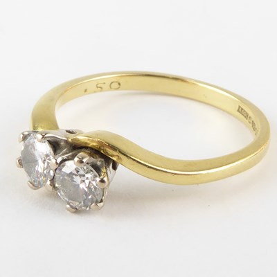 Lot 775 - An 18ct gold diamond ring, with two claw set...