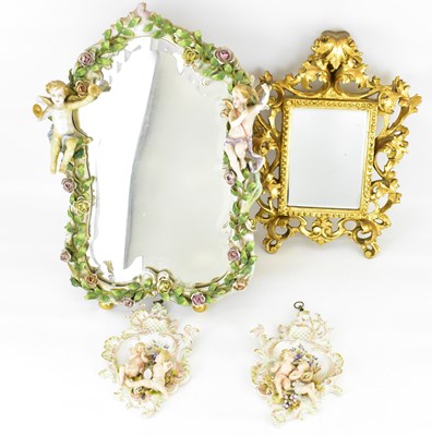 Lot 103 - A Continental porcelain cherub tabletop mirror...