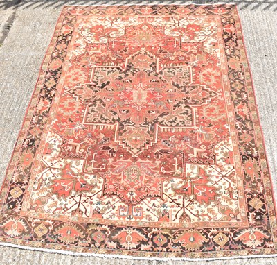 Lot 101 - A large hand knotted Persian woollen Heriz...