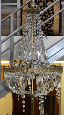 Lot 87 - A brass framed glass drop chandelier, height...