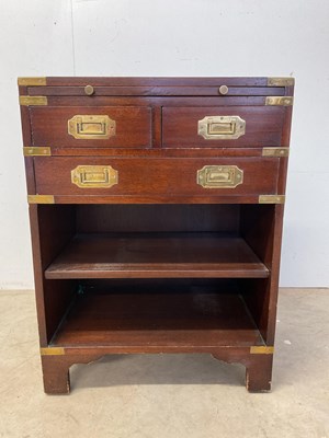 Lot 639 - A Campaign style chest/bedside cabinet of...