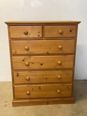 Lot 580 - A contemporary pine chest of two short over...
