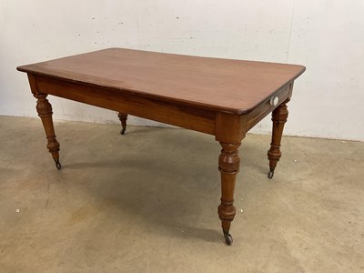 Lot 527 - A pitch pine dining table with rounded...