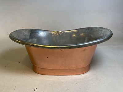 Lot 149 - A copper and silvered metal sink with central...