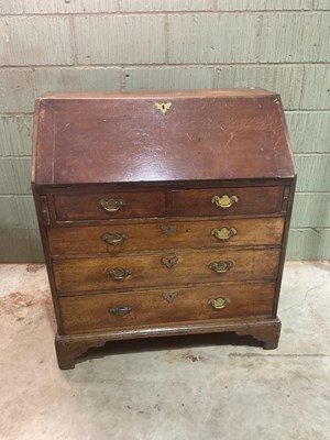 Lot 600 - A late George III oak bureau; 107cm high, 91cm...