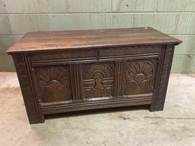 Lot 535 - An early 18th century oak coffer with carved...