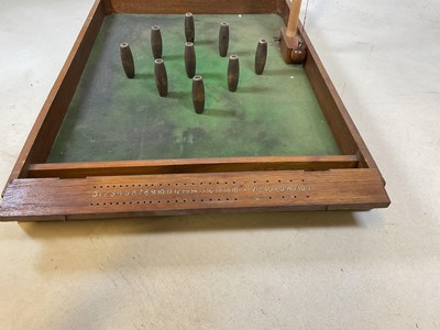 Lot 93 - A vintage table top skittles game and a shove...