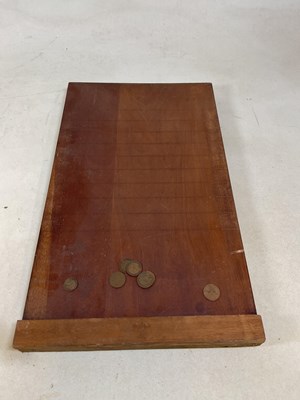 Lot 93 - A vintage table top skittles game and a shove...