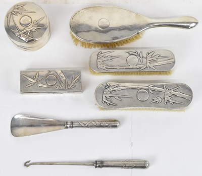 Lot 554 - YOK SANG; a Chinese Export silver seven piece...