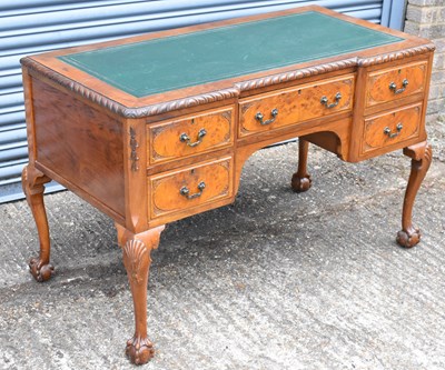 Lot 17 - An early 20th century walnut five drawer...