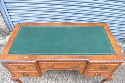 Lot 17 - An early 20th century walnut five drawer...