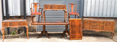 Lot 6 - An extensive walnut and crossbanded dining...
