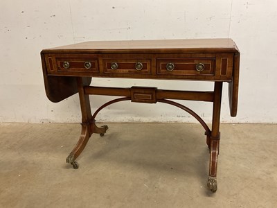 Lot 530 - A Regency style sofa table with three frieze...