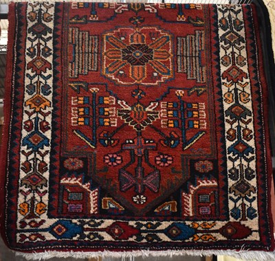 Lot 112 - A hand knotted Persian woollen rug, 137 x 86cm.