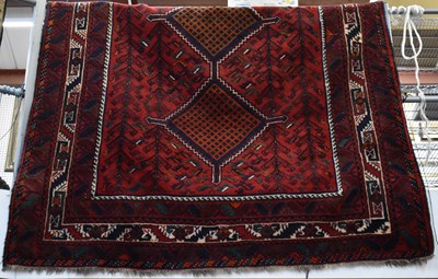 Lot 109 - A large Persian hand knotted red ground...