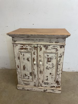 Lot 596 - A distressed painted pine cupboard with two...