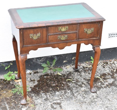 Lot 39 - An 18th century walnut lowboy, with later...