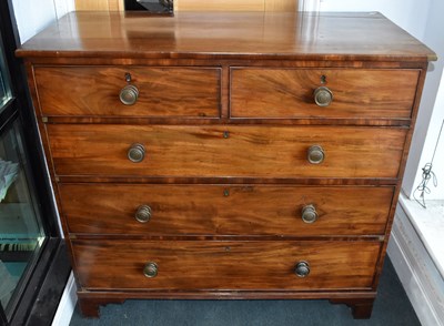 Lot 29 - An early 19th century mahogany chest of two...