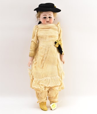 Lot 215 - A 19th century porcelain doll with painted...