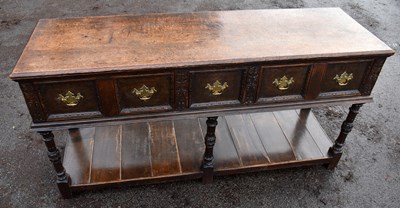 Lot 1481 - A 19th century oak dresser with three deep...