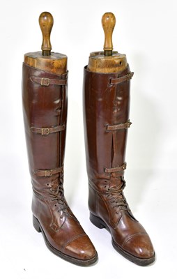 Lot 2240 - A pair of brown leather riding boots with...