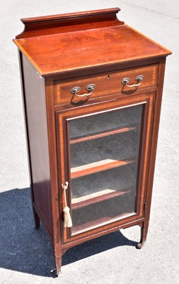 Lot 2485 - An Edwardian inlaid mahogany music cabinet,...
