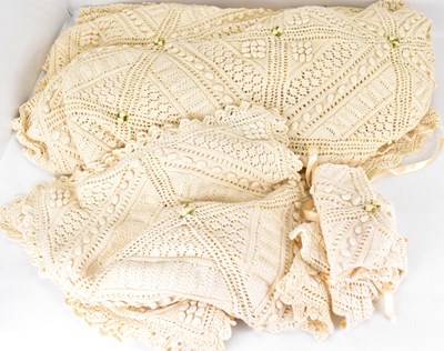 Lot 202 - A vintage cream hand-knitted bedspread...