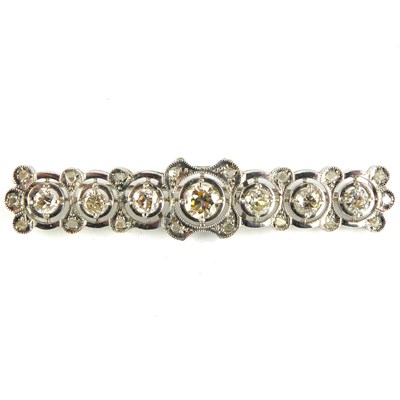 Lot 862 - An Art Deco diamond brooch, the central...