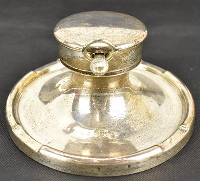 Lot 591 - A George V hallmarked silver capstan inkwell,...