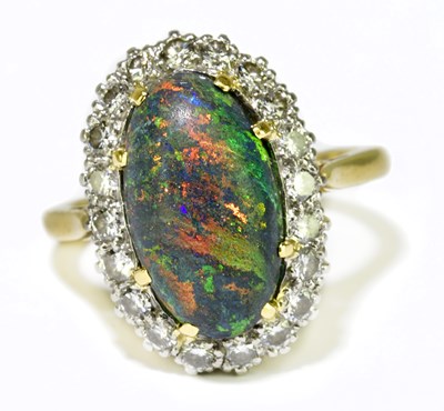 Lot 57 - A yellow metal black opal and diamond set ring,...