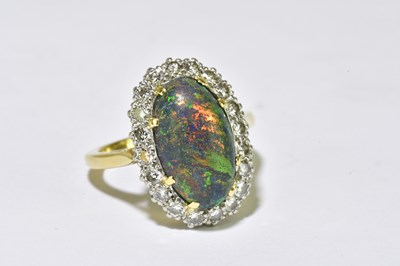 Lot 68 - A yellow metal black opal and diamond set ring,...