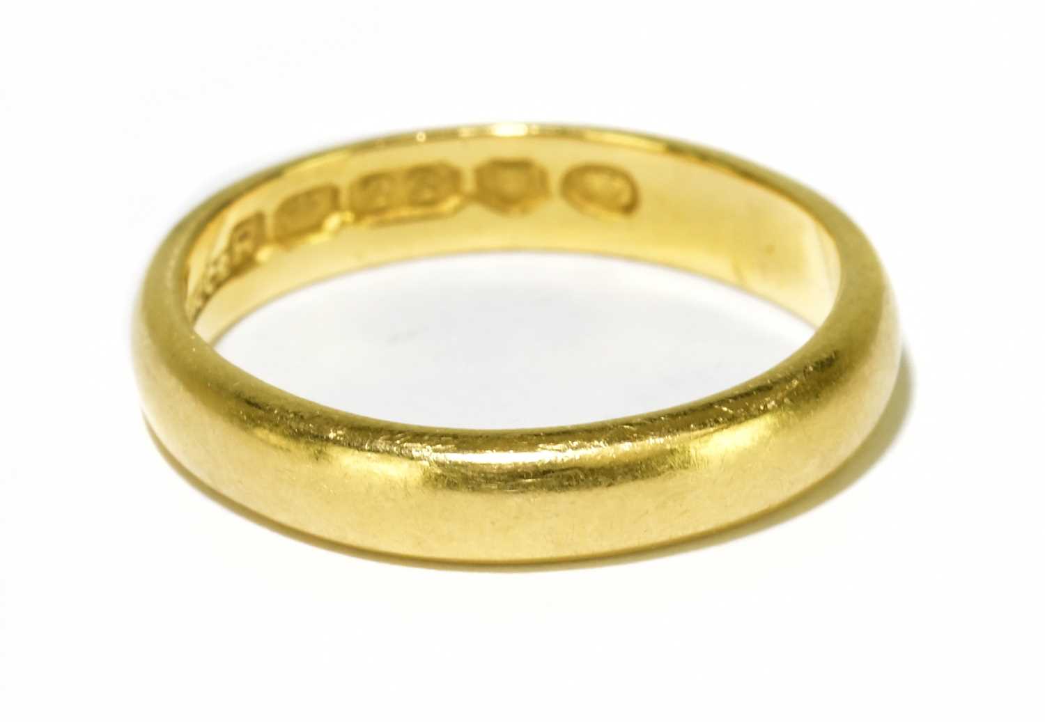 Lot 96 - A 22ct yellow gold wedding band, misshaped...