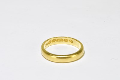 Lot 96 - A 22ct yellow gold wedding band, misshaped...