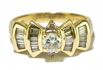 Lot 44 - An 18ct yellow gold and diamond dress ring,...