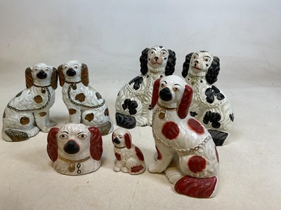 Lot 212 - Seven Staffordshire flat back dogs including...