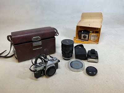 Lot 106 - An Olympus OM-1 camera in fitted case with...