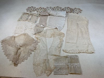 Lot 144 - A collection of mainly antique lace items...